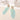 Boucles d'oreilles Blanche de Fabien Ajzenberg en acétate de teinte claire, avec motif pendant et détails dorés.