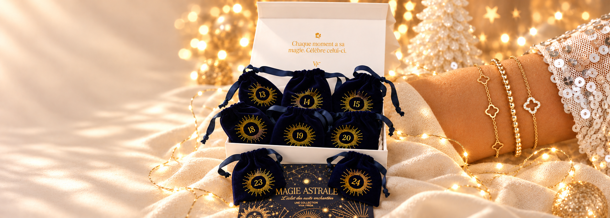 Calendrier de l’Avent Magie Astrale 12 jours Viva Frida, coffret et pochons bleu nuit avec bracelets dorés, dans un décor de Noël lumineux.