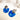 Boucles Costa de Fabien Ajzenberg en acétate bleu foncé et plaqué or, au design long et graphique.